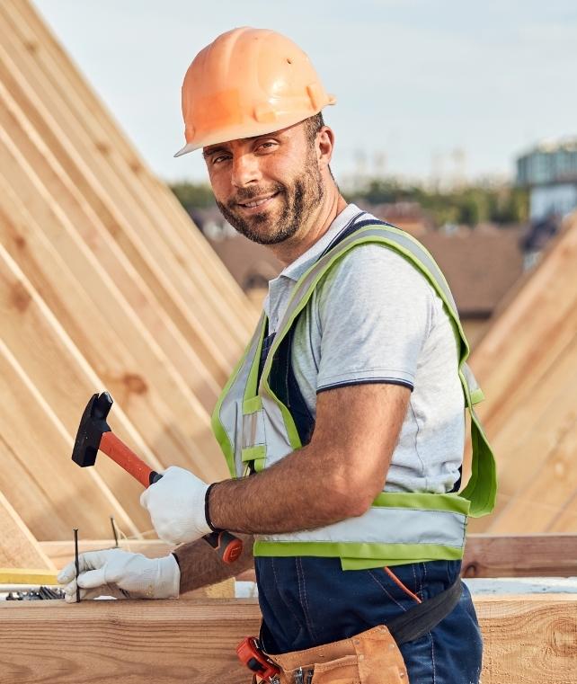 smiley-builder-using-a-hammer-at-a-construction-si-2024-10-18-08-42-55-utc