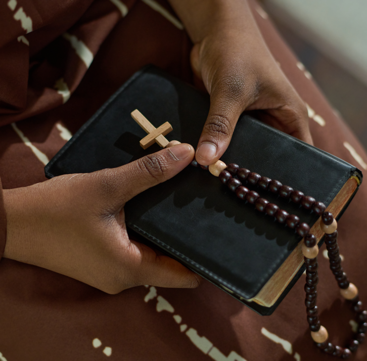 hands-of-young-african-american-parishioner-of-cat-2022-07-14-04-58-01-utc